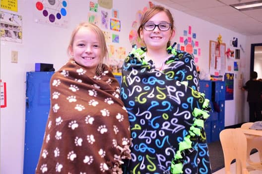 Girls wrapped in blankets